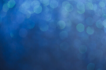 abstract blue bokeh glitter sparkle background.