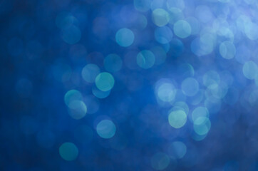 abstract blue bokeh glitter sparkle background.