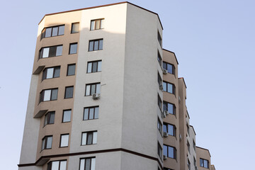 Cityscape with facade of a modern residential building. Modern European residential apartment building. Modern minimalistic architecture. Apartment Building. New and stylish living block of flats. 