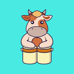 Cute cow is playing drums.
