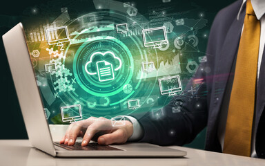 Business hand typing on a modern laptop