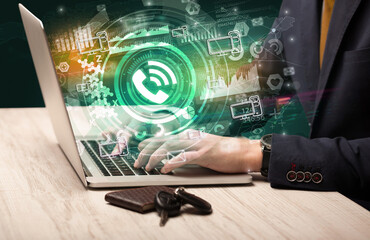 Business hand typing on a modern laptop