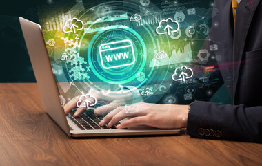 Business hand typing on a modern laptop