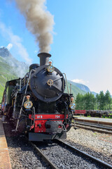 Fototapeta na wymiar Furka steam train. Mountain route. HG number 704. Switzerland
