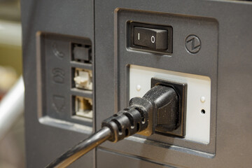 Power cord plugged into a power outlet.