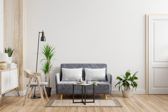 Living room interior wall mockup with sofa,armchair and plants on empty white wall background.