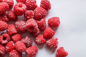 Frozen raspberries.  Fresh red raspberries isolation on white