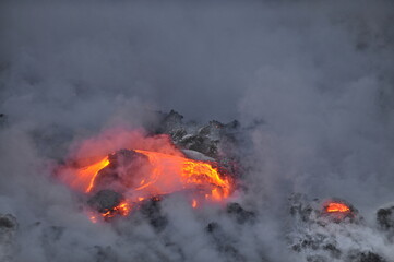 Hawaii. Volcanic eruption. Fiery lava flows into the ocean