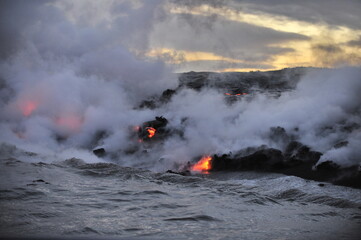 Fototapeta na wymiar Hawaii. Volcanic eruption. Fiery lava flows into the ocean