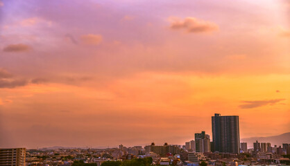 Panorama view of Tokyo Japan cityscape at the sunset and twilight period witch Japanese residential building and vivid colourful multi colour sky as a background.