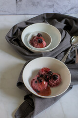 Bowl with forest fruits ice cream, bowls with ice cream and bowl with frozen forest fruits.