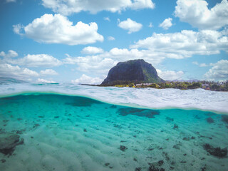 Tropical transparent ocean with Le Morne mountain and beach in Mauritius. Split view.