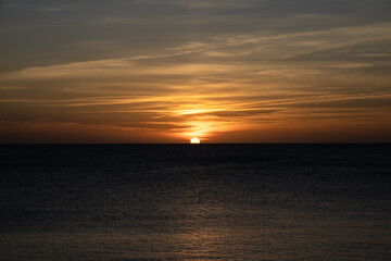 Sunset in Ibiza, sun goes down into the sea, Spain