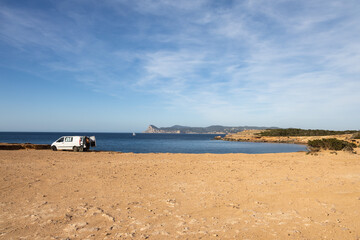 Fototapeta na wymiar Cala roja in Ibiza, rocky seashore with crystal blue water, Spain