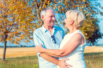 Obraz premium Senior woman and man, couple, embracing each other