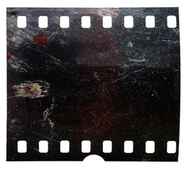 underexposed film material on white. grungy looking film frame isolated.