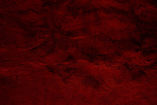 Crimson colored wall background with textures of different shades of crimson red