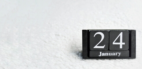 Wooden calendar from blocks on white background with copy space. 24th of January