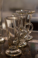 Close up empty glasses in restaurant natural light. selective focus and blur background.