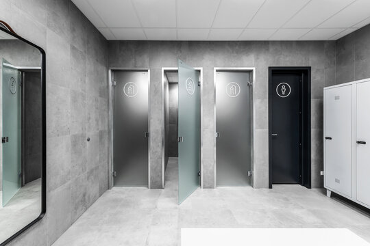 Modern minimalist interior of public shower room with grey clay wall