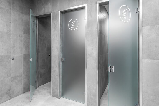 Modern minimalist interior of public shower room with grey clay wall