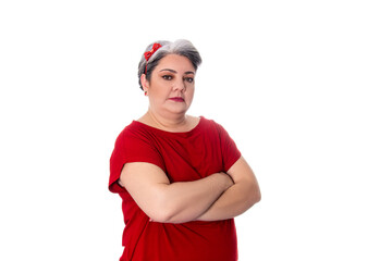young lady wearing red outfit on white background with arms crossed.