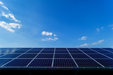 Photovoltaic solar panels on blue sky background