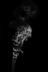 Black and white photo of smoke clouds on a black background
