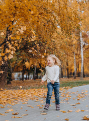 happy children play autumn park up fallen