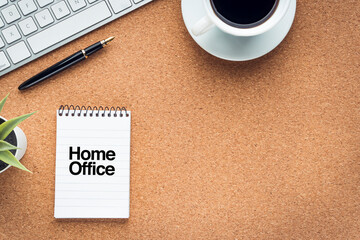 HOME OFFICE text with coffee cup, keyboard, fountain pen and  decorative plant on wooden background. Covid-19, Business and copy space concept..