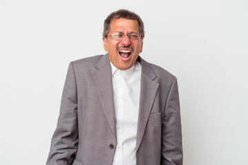 Middle aged indian business man isolated on white background screaming very angry and aggressive.