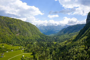 Voye valley in slovenia near lake bohinj with beautiful green forests.