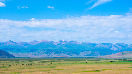 Landscapes of Raimbek region on sunny summer day. Road A-351 near Kainar village, Kazakhstan