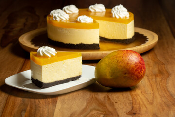 Homemade mango cheesecake with whipped cream flowers