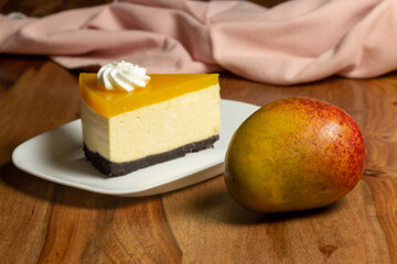 Homemade mango cheesecake with whipped cream flowers