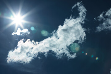 Naklejka na ściany i meble Beautiful clouds with the sun on the background of the deep blue sky.