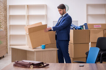 Young male employee in relocation concept