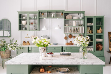 Comfortable apartment kitchen interior with green furniture - obrazy, fototapety, plakaty