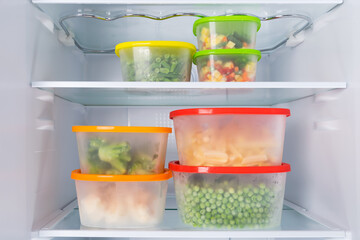 a set of containers with vegetables, sliced and peeled, ready for cooking, peas, broccoli corn, potatoes
