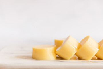 Egg tofu sliced on marble cutting board.