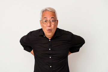 Senior american man isolated on white background being shocked because of something she has seen.