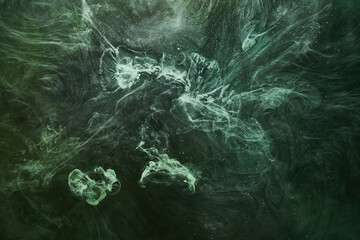 Abstract green color background. Swirling vibrant hookah smoke, underwater emerald ocean, dynamic paint in water