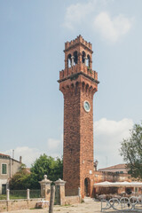 Obraz premium Clock Tower at Campo Santo Stefano on island of Murano, Venice, Italy