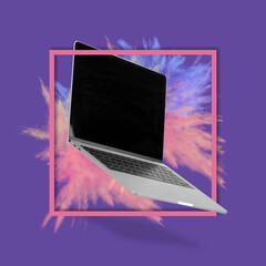 Laptop  computer with empty screen  with powder explosion, while levitating in the air on a purple background.
