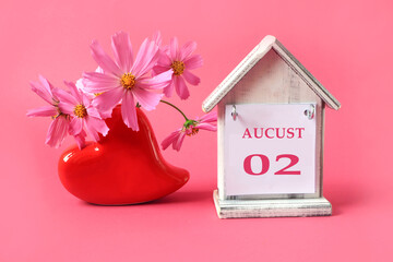Calendar for August 2 : the name of the month of August in English with the numbers 0 and 1 on a...