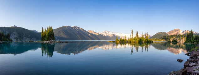 Panoramic View of Canadian Nature Landscape with rocky islands and mountains in the background. Garibaldi Lake, Near Whistler and Squamish, North of Vancouver, British Columbia, Canada. Sunny Summer