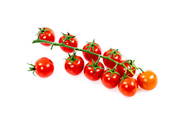 Cluster of solitary cherry tomatoes with one loose tomato on white surface