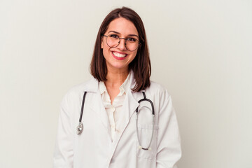 Young doctor caucasian woman isolated on white background happy, smiling and cheerful.