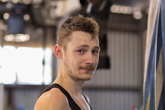 head and shoulders of young shearer glowing with sweat
