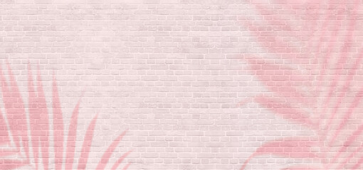 Panoramic background of wide old pastel pink brick wall texture with palm tree shadows. Modern trend backdrop